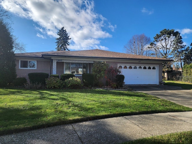 single story home featuring a front yard and a garage