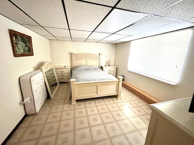 bedroom featuring a paneled ceiling