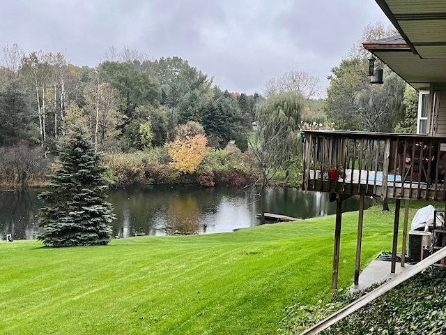 view of yard featuring a deck with water view