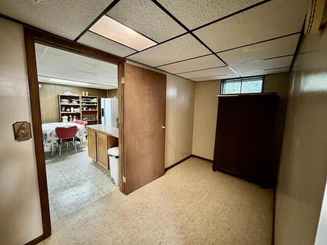 hallway with a drop ceiling