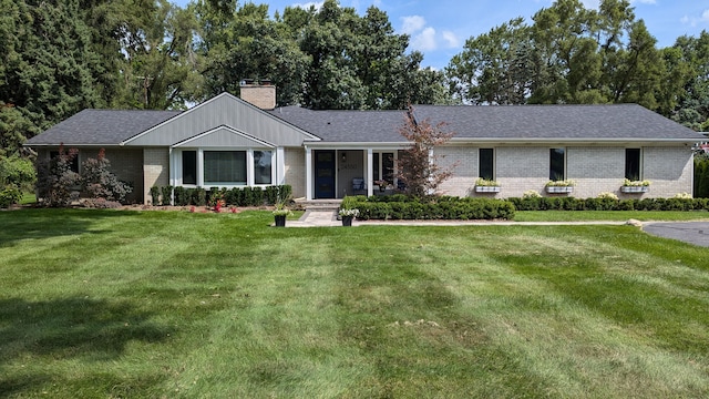 ranch-style home featuring a front yard