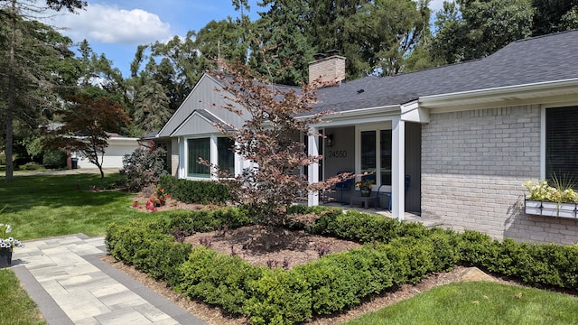 view of property exterior with a lawn