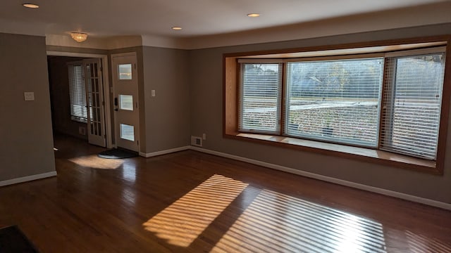 entrance foyer with dark hardwood / wood-style flooring