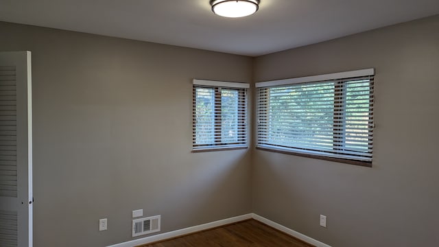 spare room featuring hardwood / wood-style flooring