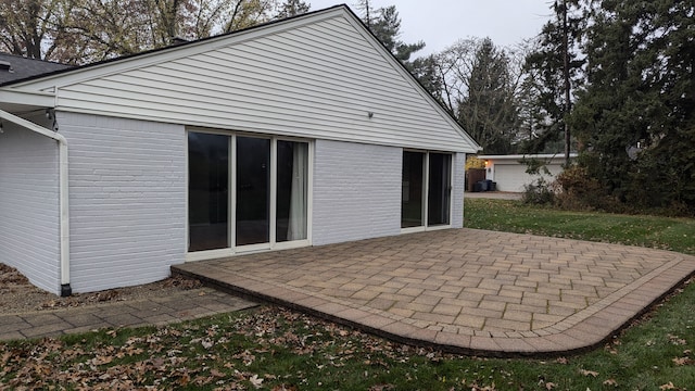 back of house with a patio