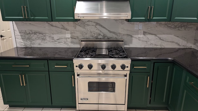 kitchen featuring designer range, exhaust hood, and green cabinetry