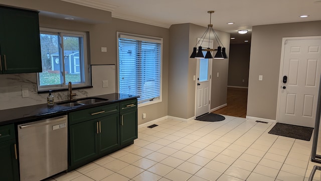 kitchen featuring sink, light tile patterned floors, decorative light fixtures, and dishwasher