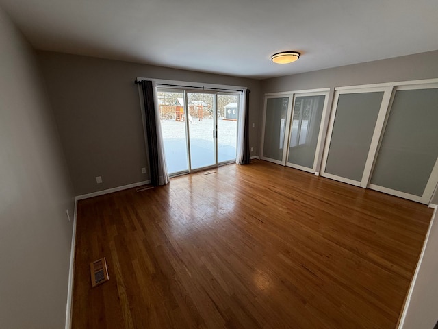 empty room featuring dark hardwood / wood-style floors