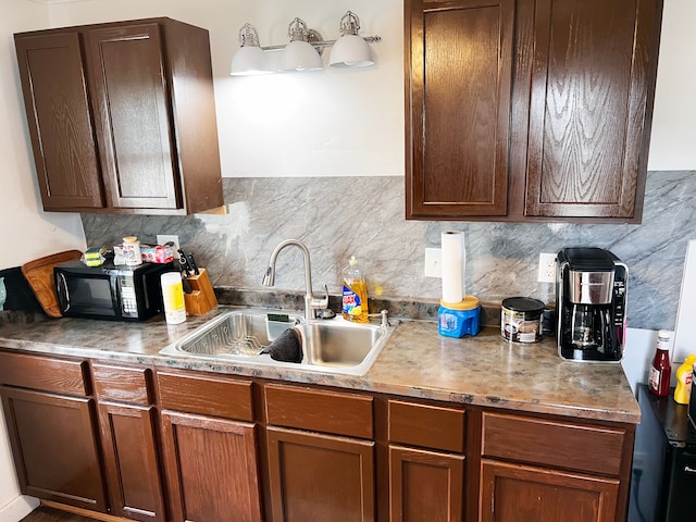 kitchen with decorative backsplash and sink