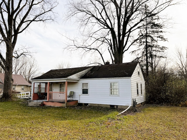 back of house with a yard