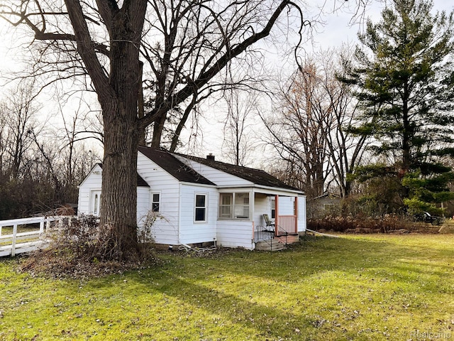 2360 Virginia Ave, Saginaw, MI 48601 - view of home's exterior featuring a chimney