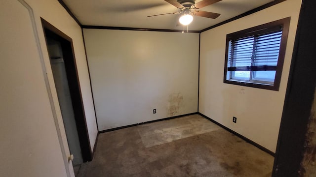 unfurnished bedroom featuring carpet, ceiling fan, and crown molding