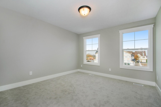 empty room featuring carpet floors