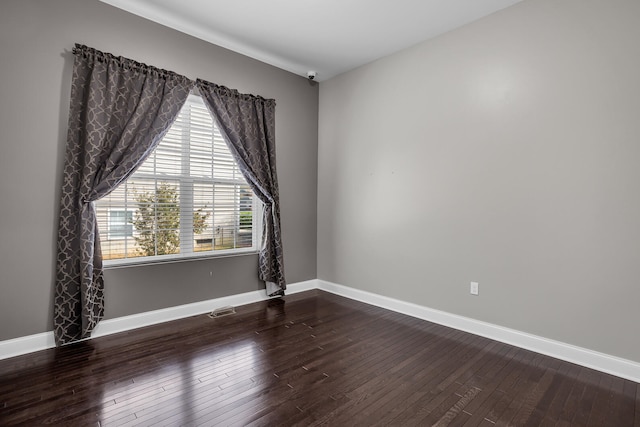 unfurnished room featuring hardwood / wood-style floors