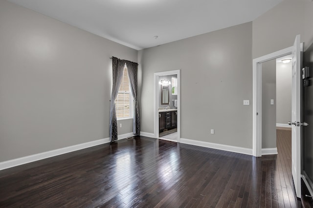 unfurnished room featuring dark hardwood / wood-style floors