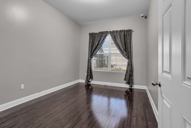 empty room with wood-type flooring