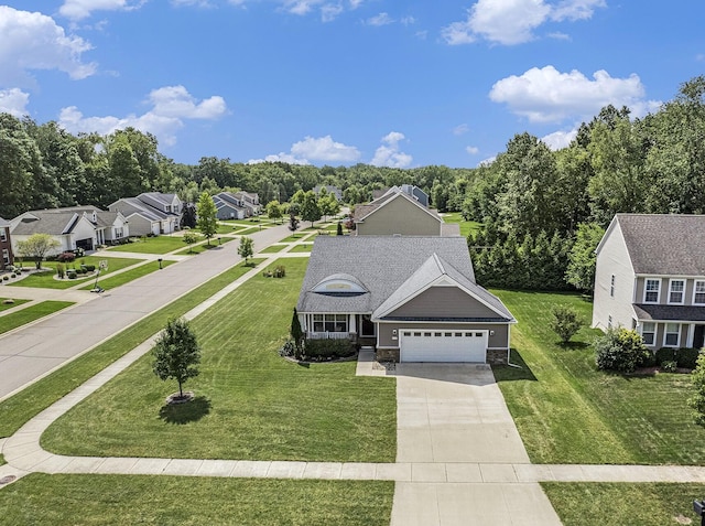 view of front of house with a front yard and a garage