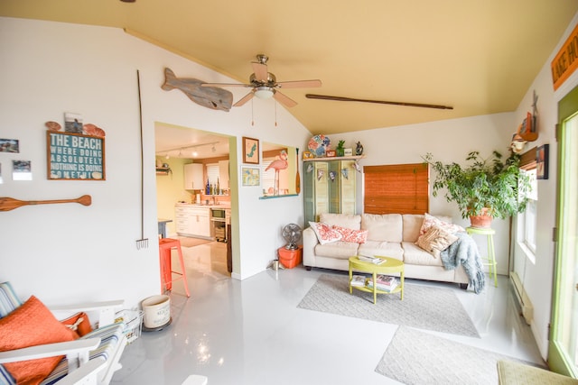 living room featuring ceiling fan, concrete floors, and vaulted ceiling