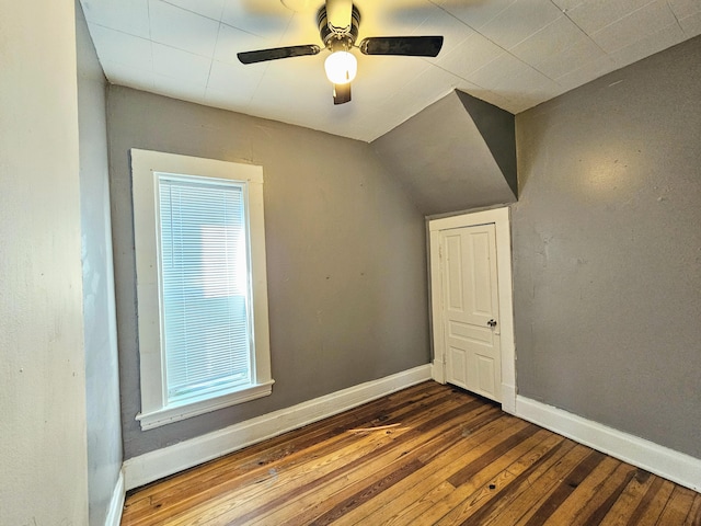 additional living space with ceiling fan, dark hardwood / wood-style flooring, and lofted ceiling