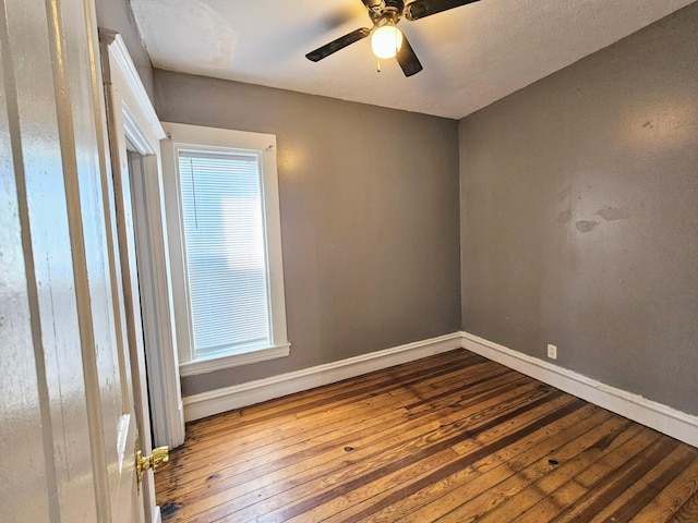 unfurnished room featuring hardwood / wood-style floors and ceiling fan