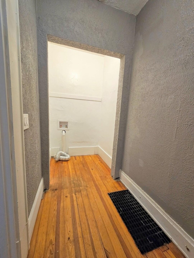 corridor featuring hardwood / wood-style floors