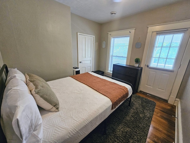 bedroom featuring dark hardwood / wood-style floors