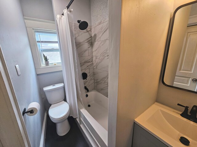 full bathroom featuring shower / bath combination with curtain, vanity, and toilet