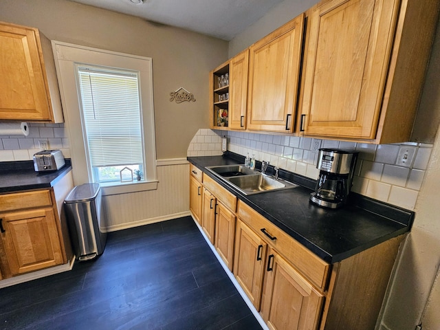 kitchen featuring dark hardwood / wood-style flooring, sink, and tasteful backsplash