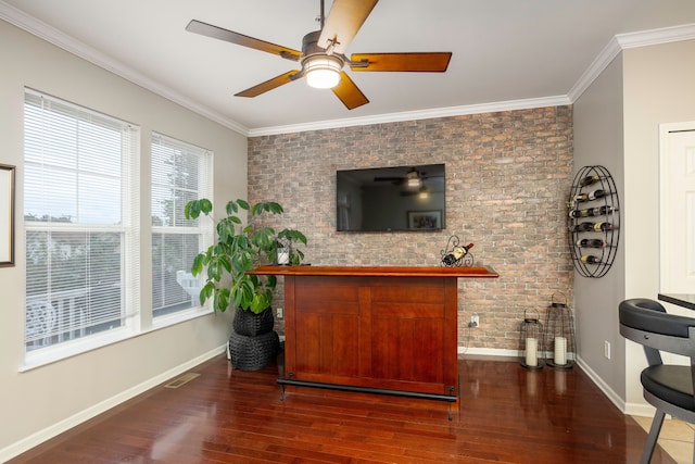 bar featuring ceiling fan, dark wood-type flooring, brick wall, and ornamental molding