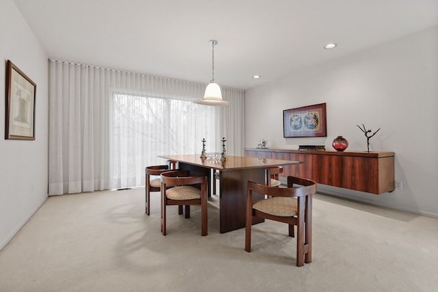 dining room with light carpet