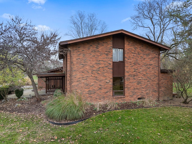 view of home's exterior with a lawn