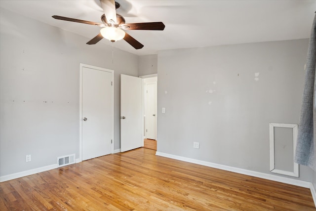 spare room with ceiling fan and light hardwood / wood-style flooring