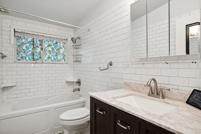 full bathroom with tiled shower / bath combo, tasteful backsplash, toilet, vanity, and tile walls