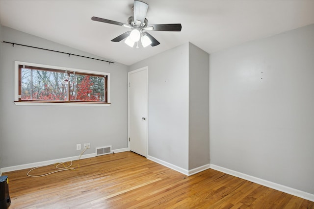 unfurnished room with light hardwood / wood-style flooring, ceiling fan, and lofted ceiling