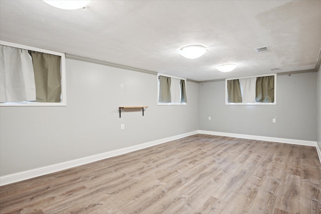 basement featuring light hardwood / wood-style floors