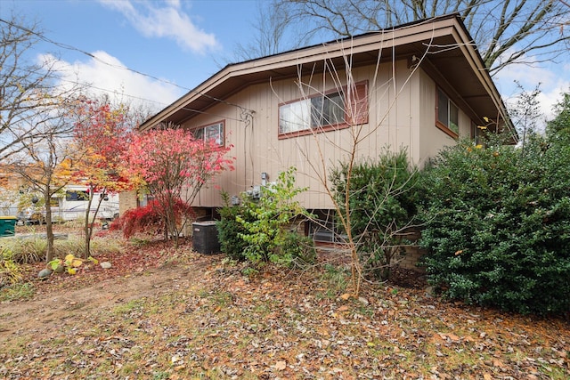 view of side of home featuring central AC unit