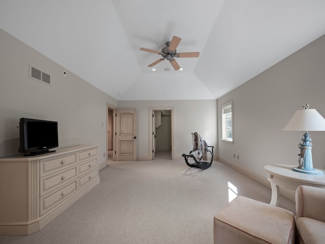 sitting room featuring ceiling fan, light colored carpet, and vaulted ceiling