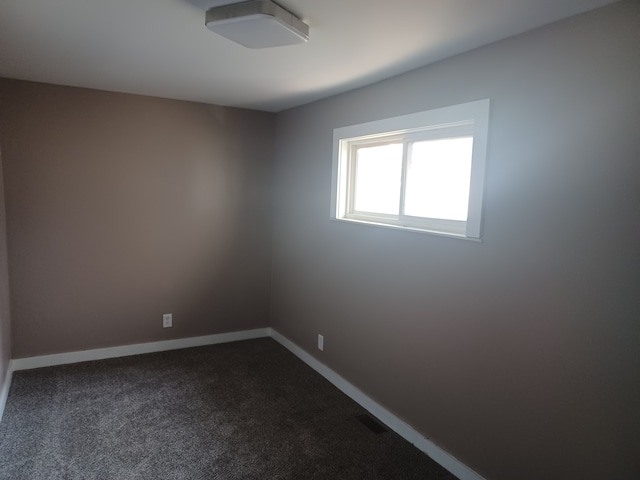 empty room with carpet flooring