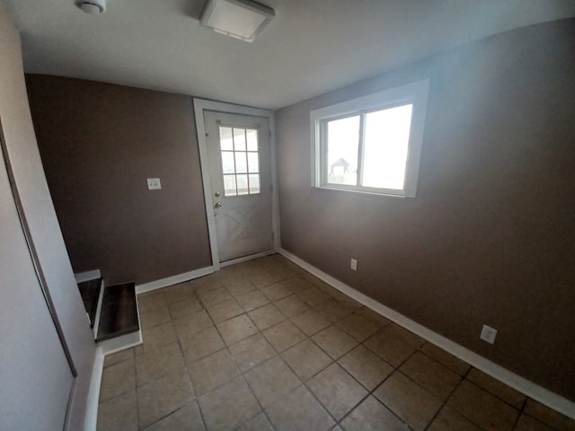 interior space with light tile patterned floors