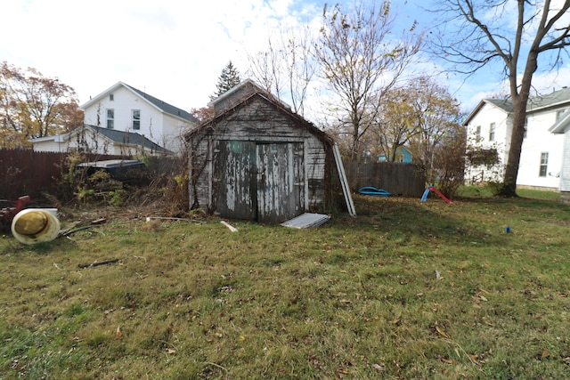 view of outbuilding featuring a lawn