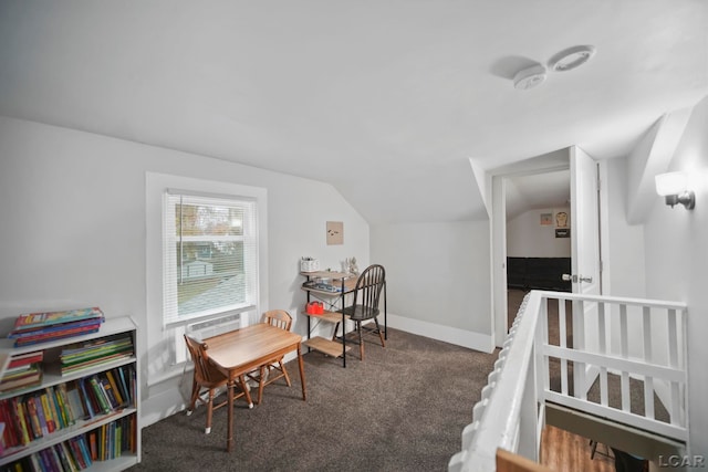 bedroom featuring dark carpet and lofted ceiling