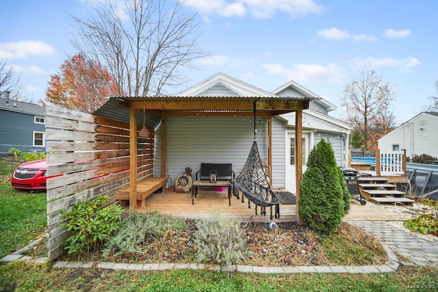 back of house featuring a deck