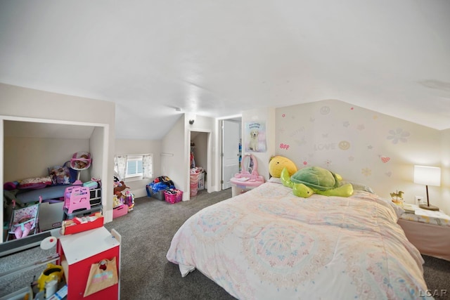 carpeted bedroom with lofted ceiling