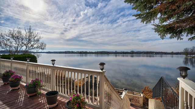 wooden deck with a water view