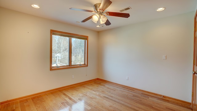 empty room featuring ceiling fan and light wood-type flooring