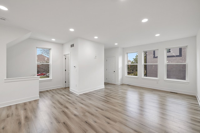 interior space featuring plenty of natural light and light hardwood / wood-style flooring