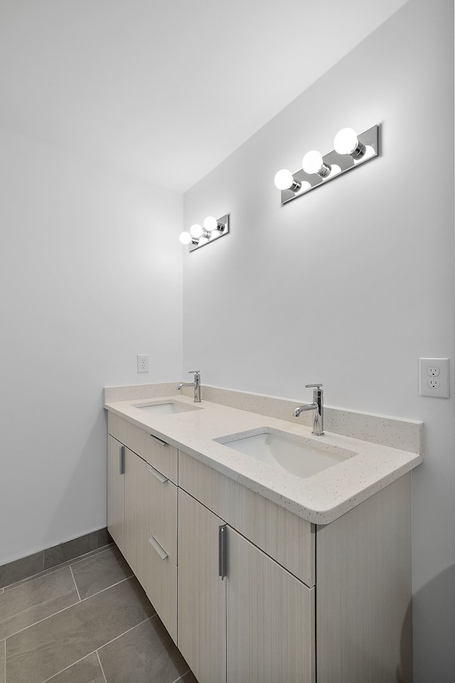 bathroom with tile patterned floors and vanity