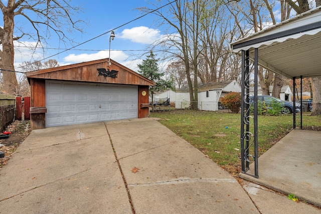 garage featuring a lawn