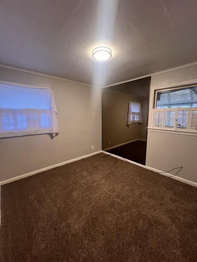 2910 Shawnee Ave, Flint, MI 48507 - carpeted empty room with baseboards and ornamental molding