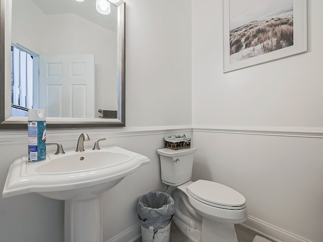 bathroom with toilet and sink